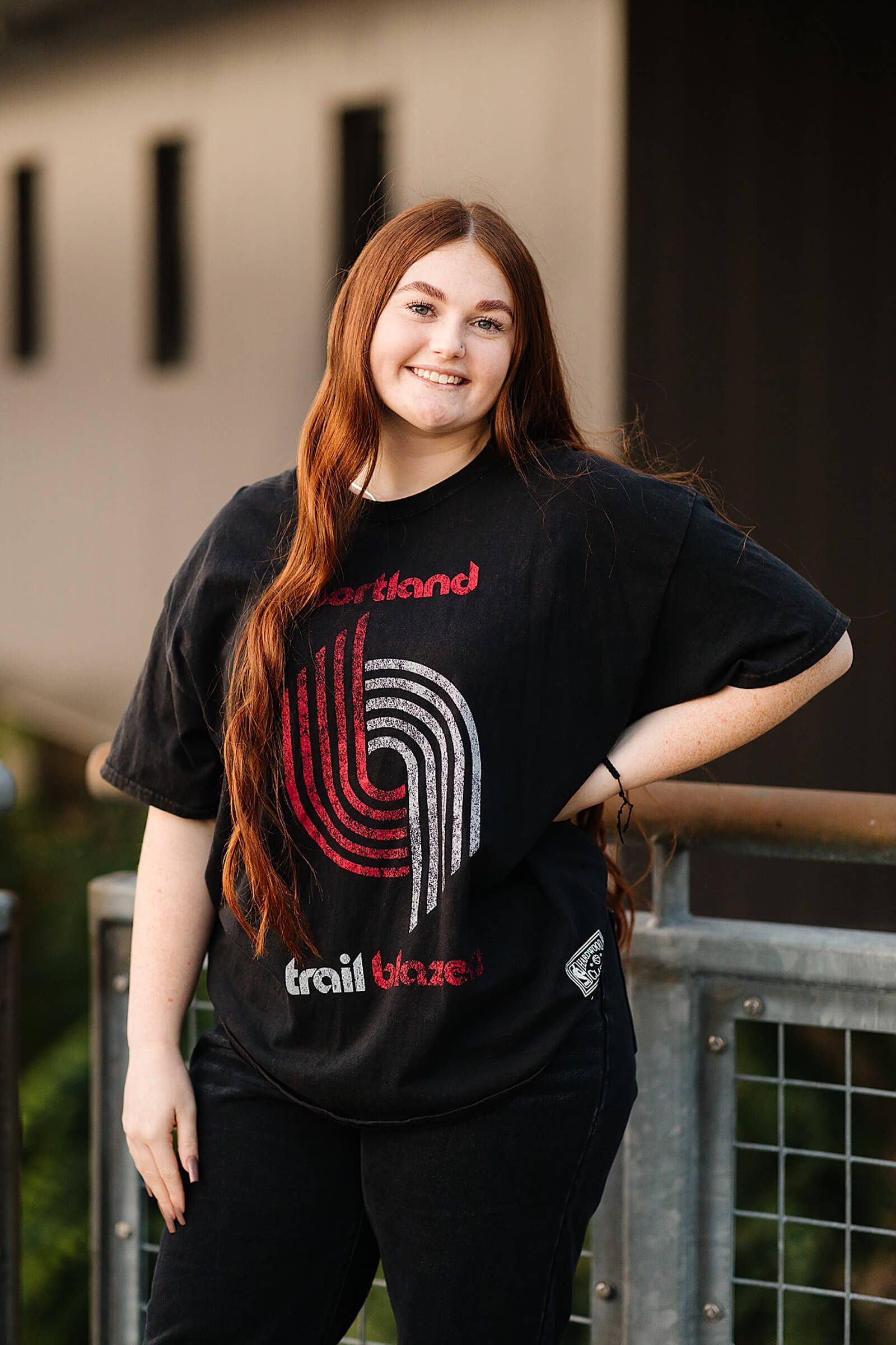girl with red hair in vintage trail blazer black t-shirt