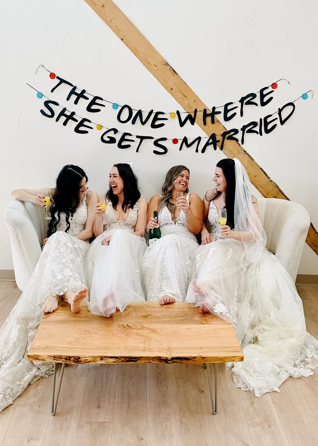 four girls in wedding dresses at bespoke bride