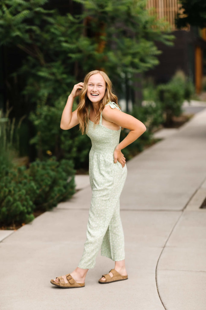 blonde girl in green jumpsuit in downtown bend oregon