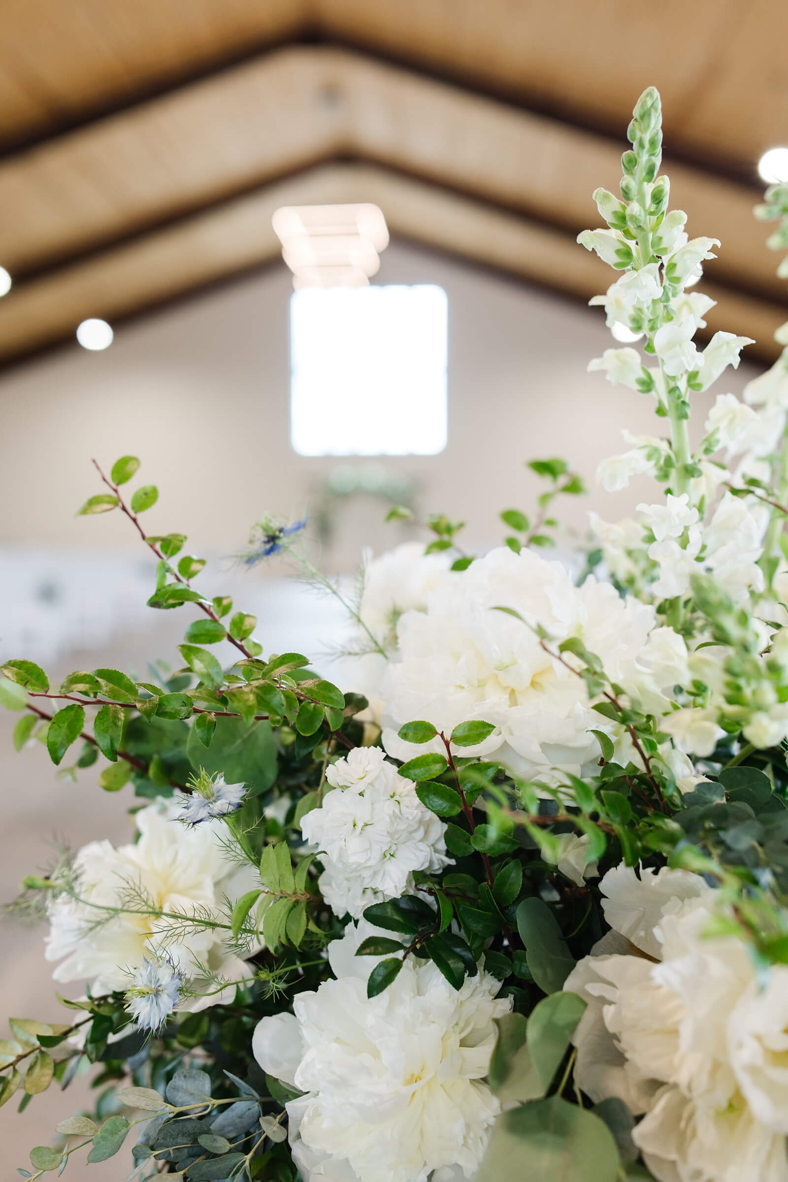 white and green wedding floral design at the barn at countryside