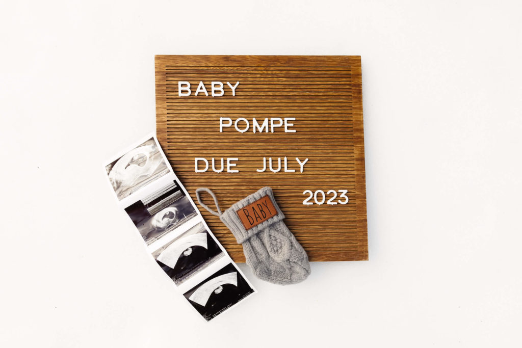 letter board spelling out pregnancy due date during pregnancy announcement photoshoot