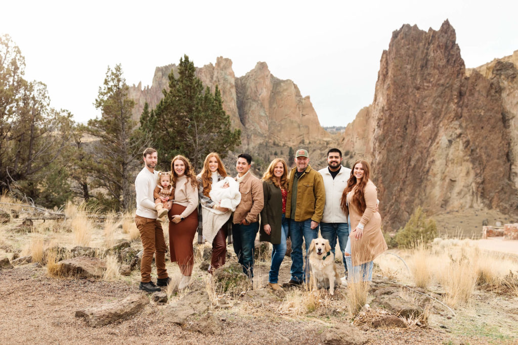 Large family standing in smith rock state park during family photoshoot