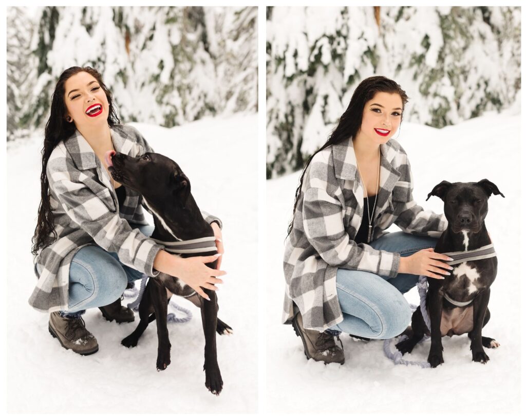 brunette teenage girl with red lipstick cuddling mixed breed black dog in the snow during senior photoshoot 