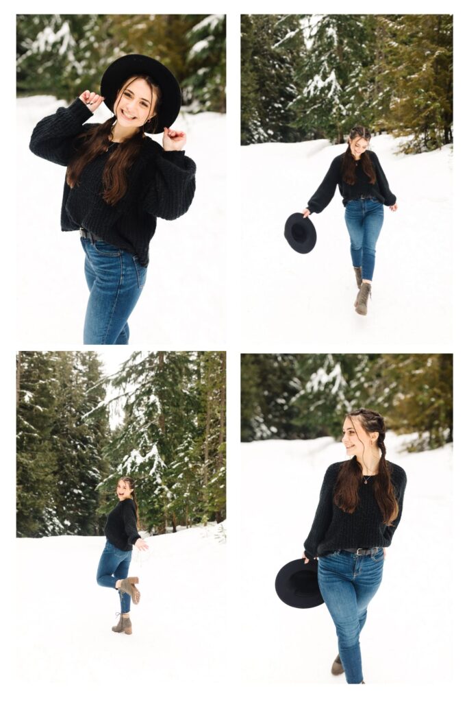 brunette senior in high school with pigtails posing in snow wearing black wide brimmed hat during senior photos