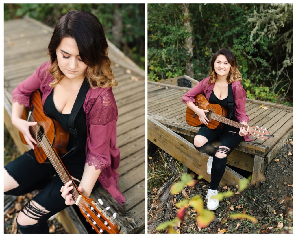 young brunette female sitting on bridge playing guitar during senior photo session