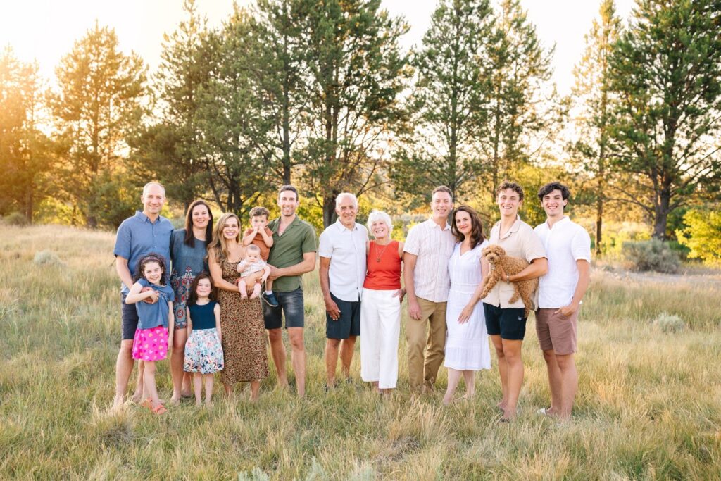 Three generations standing together for family photos in Central Oregon during a summer family gathering.